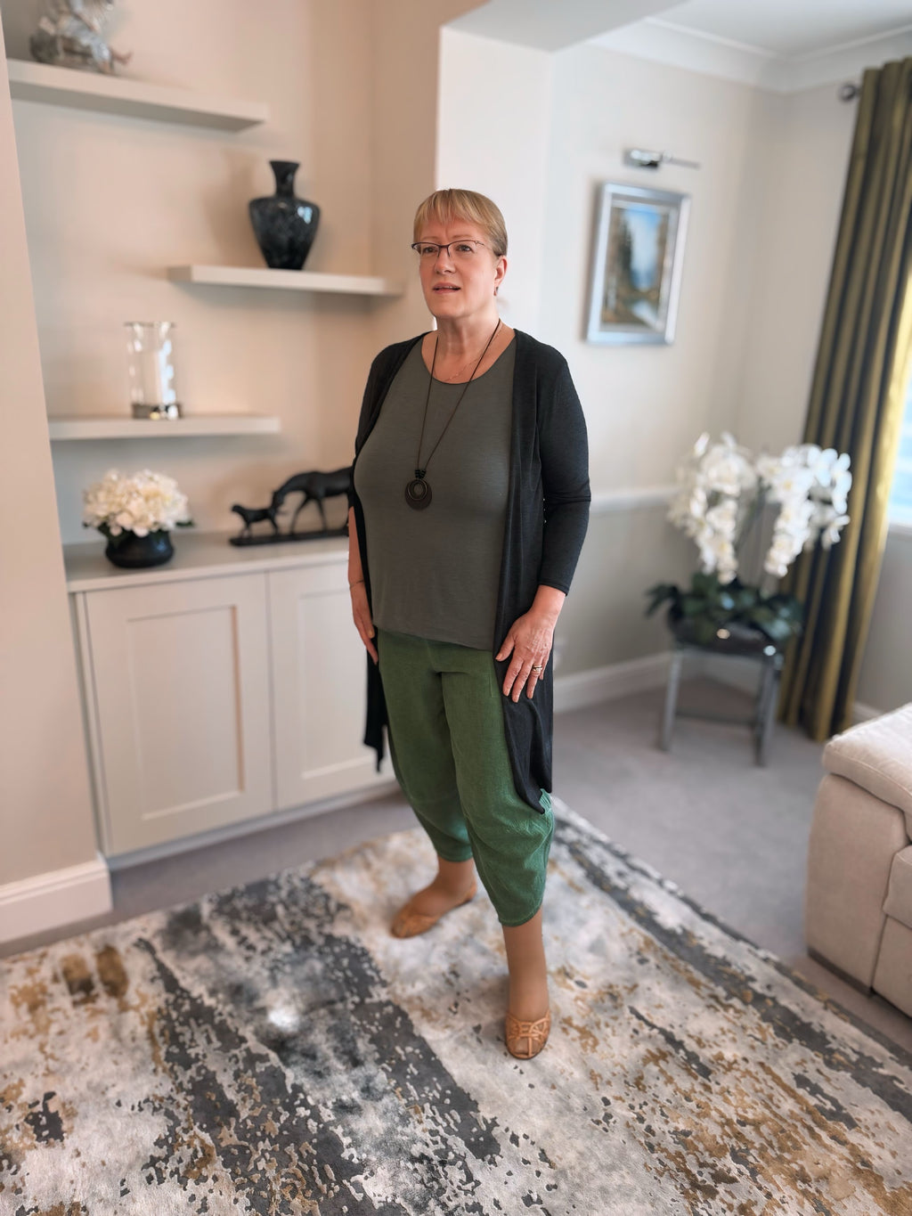 Woman wearing forest green cotton harem pants